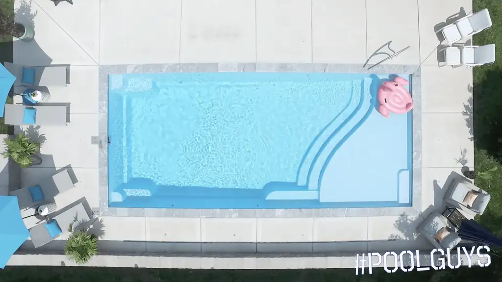 Straight-down view of a rectangular pool with corner entry steps